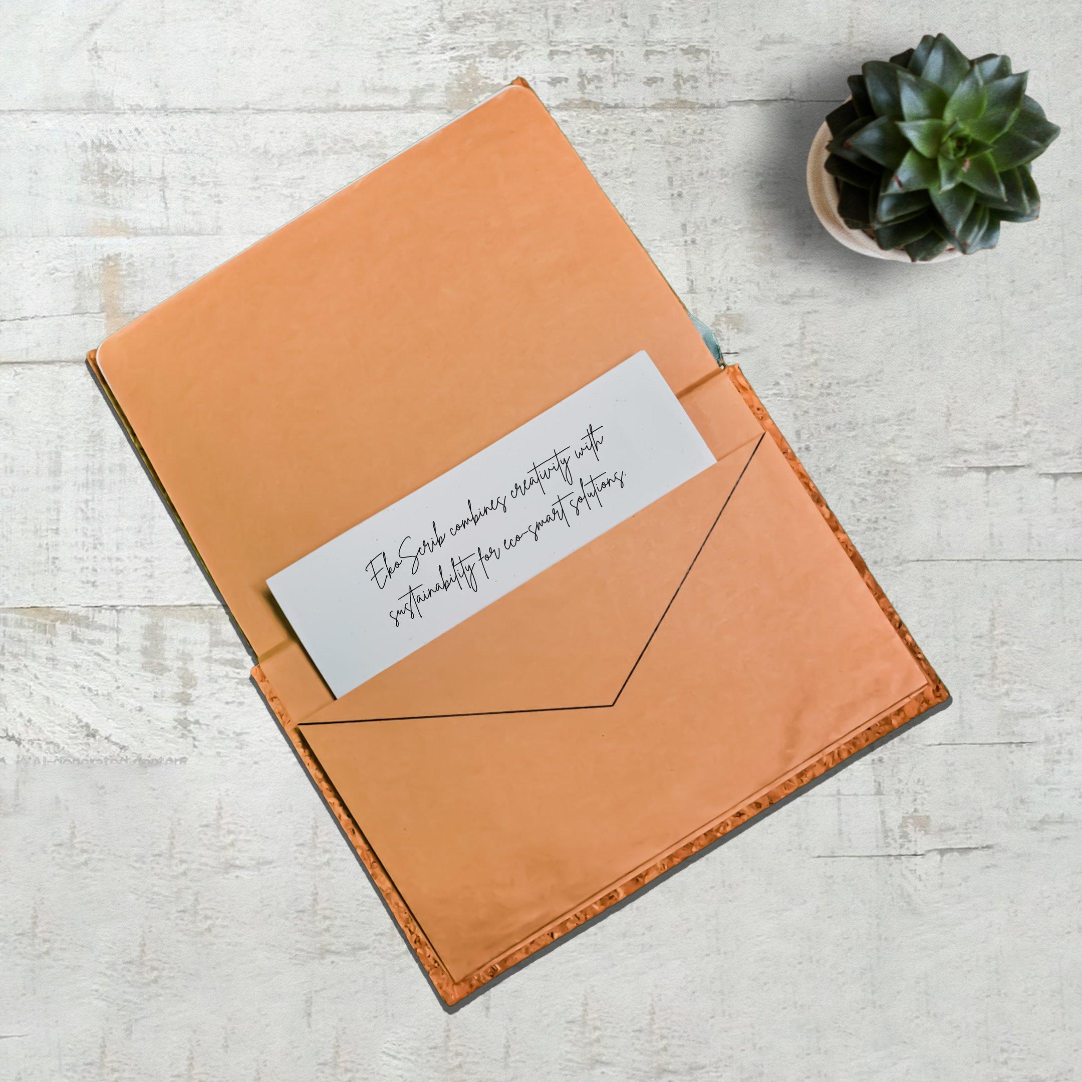 Minimalist cork-covered journals with a pen and succulent